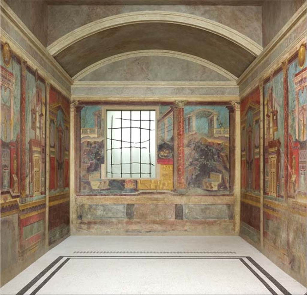 Villa of P. Fannius Synistor at Boscoreale. After the 2007 restoration and relocation. Cubiculum M and alcove with frescoes and mosaic floor. Note the position of the threshold mosaic strip dividing the alcove from the main room and the plain mosaic floor. The cubiculum was about six metres long, by four metres wide, and was divided into two parts, the room itself and an alcove. The room was two-thirds of all the space, the alcove occupied the rest at the rear. It was a real alcove, with the front ends ending in an arch closed with doors or curtains. The ceiling of the alcove was vaulted and with an arched rear wall, while the ceiling of the rest of the room was flat. The floor was marked with a dividing strip to separate the space where the bed was to be situated. This division almost simulated the threshold of another room. The floor was of white mosaic edged with two black bands in the room, and with pure white mosaic inside the alcove. The dividing strip, mimicking the threshold, was of coloured mosaic, striped with five rows, alternatively white and red, white and black. See Barnabei F., 1901. La villa pompeiana di P. Fannio Sinistore. Roma: Accademia dei Lincei. p. 72. Photo © The Metropolitan Museum of Art, Rogers Fund 1903. Inventory numbers 03.14.13a-g. See www.metmuseum.org