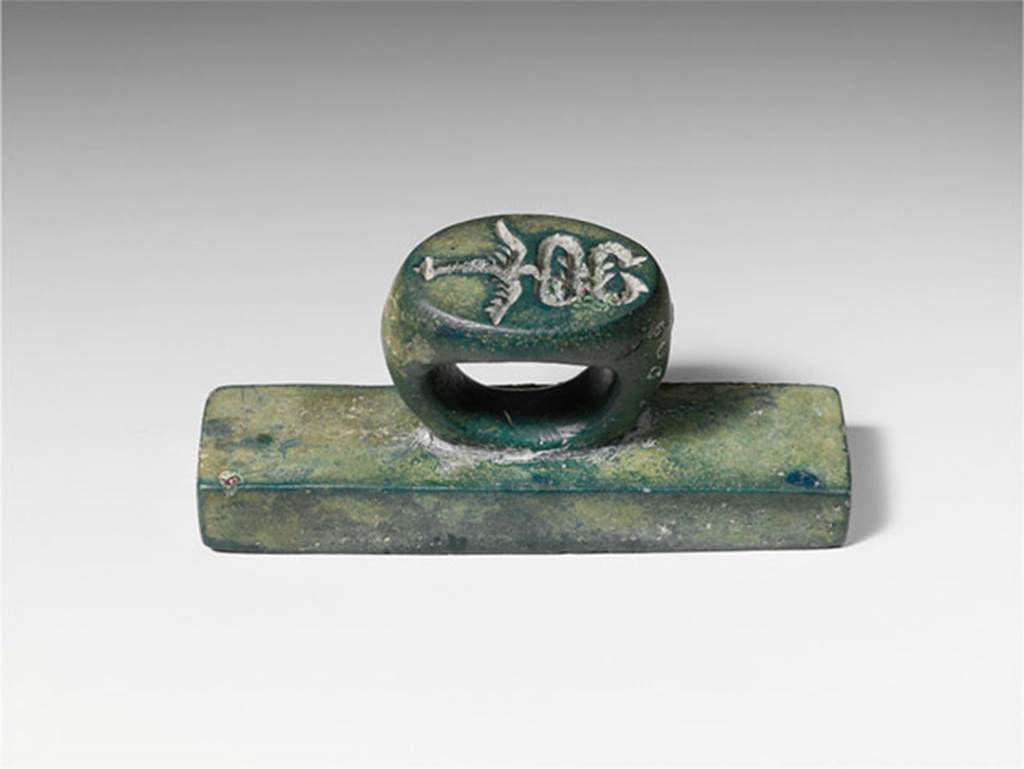Villa of P Fannius Synistor at Boscoreale. Bronze seal and stamp engraved L. HER. FLO. According to the Metropolitan Museum New York, on the ring in intaglio (carved) is a second seal in the form of a winged caduceus, the staff of Mercury, god of commerce. Many such bronze seals have been found in the excavations at the nearby towns of Pompeii and Herculaneum, although stamps with intaglio on both ring and plate are less common. 
Photo © The Metropolitan Museum of Art, Fletcher Fund 1930. See www.metmuseum.org
