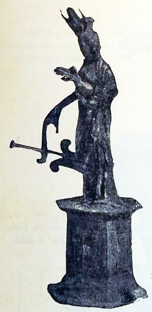 Scafati, Villa rustica detta di Domitius Auctus. 18th March 1899. Room “D”.
A silver statuette of Isis-Fortuna, 0.13m tall with the small hexagonal pedestal also of silver.
On her head, she has a modius (cylindrical headdress), a crescent moon and a lotus flower.
With the right hand, she held up a rudder and on the left wrist was a bucket and some corn. 
It was finely worked and was important for the fusion of elements, more accentuated than what is seen in the figure of Isis-Fortuna in Pompeian paintings. 
See Notizie degli Scavi di Antichità, 1899, p. 393, fig. 2.