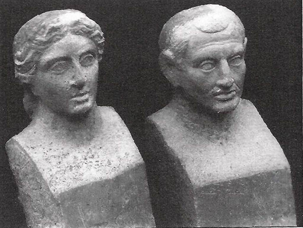 Pompeii, Villa rustica nel Fondo di Antonio Prisco. Tomb “D”.
Two travertine portraits busts found in a semi-circular niche on the west side of the tomb.
If the funeral title tablet had been recovered, we would have known who was portrayed in the two travertine busts, found in a special semi-circular niche 0.90m high; opened just below the mentioned marble slab. The two interesting portraits depict certainly the resemblance of the couple who provided for the erection of the monument; but, having to be exposed rather high up, the busts were not finished but here and there they were only sketched: the trunks were shaped as herms: 0.73m high.
In the east wall, 1.50 m above the ground, was the door, monolithic, of Vesuvian stone, mounted between threshold, architrave and door-jambs equally monolithic and of the same stone, 0.80 m high. The door-jambs being slightly inclined at the top, the door, which opened from the outside in, appeared pyramidal externally. 
The interior of the tomb, a columbarium (a place for the respectful storage of cinerary urns) all covered with white stucco, consisted of two floors, the higher at the height of the threshold of the door, the lower, about 2 m underneath the first, and accessible by a central hatch of 0.70 m at the side.  
In the upper floor, in each corner was embedded a terracotta pot over a small masonry pedestal; at the same level a channel was open along the walls; in the western wall two circular openings, opened above the mentioned channel, communicating with the exterior; in the opposite eastern and western walls are two semi-circular niches, 0.60 m high. 
The lower floor was a columbarium of thirty-two niches, presenting eight semi-circular niches on each wall, arranged in two superimposed orders. Of the pots, and the remains they held, only a few fragments were found, because the columbarium had already been disturbed a long time ago, from searchers who penetrated from the tholos, which was probably not fully covered over by the 79AD eruption, demolishing the solid masonry.
See Stefani G., 1998. Pompei oltre la vita: Nuove testimonianze dalle necropoli, p. 106-8.
See Della Corte M., Notizie degli Scavi di Antichità, 1921, p. 416, fig. 4.