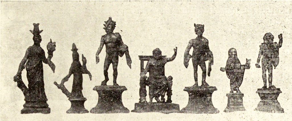 Boscoreale, La villa del Fondo Acunzo. 1903. Room 12.  Podium “y”.
Group of seven bronze statuettes found on podium built against the east wall of the room which opened off the kitchen 8: 
Centre: Jupiter seated
To the left: Helios with radiant crown
Furthest left: Two figures of differing sizes representing Isis-Fortuna
To the right of Jupiter: Mercury or a young nude faun with pan pipes 
Further right: Genius familiaris wearing a toga
Right hand end: Standing Jupiter or Neptune with arm raised
See Notizie degli Scavi di Antichità, 1921, p. 440-1, fig.11.
See Boyce G. K., 1937. Corpus of the Lararia of Pompeii. Rome: MAAR 14.  (p.100, no.500B).
