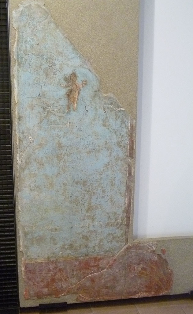 Boscoreale. Villa of Numerius Popidius Florus. Cubiculum 21. Second part of fourth style north wall.
A cupid is carrying pan pipes in the left hand.
Erote recante nella sin. la siringa.
Photo courtesy of Michael Binns. Now in Boscoreale Antiquarium.