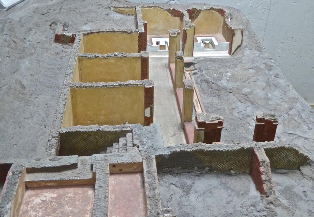 Complesso dei triclini in località Moregine a Pompei. Earlier model with triclinium D and triclinium E shown at far end undecorated but with their triclinii.
The walls of A, B, and C are shown without their frescoes. The kitchen is still unexcavated at the top left. 
Photo courtesy of Michael Binns.