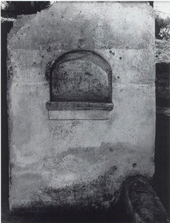 53. Scafati, Villa N. Popidi Narcissi Maioris. Arched niche lararium on west wall in room 8.
Nella parete O lo zoccolo di intonaco raggiunge un’altezza di m. 1,24 ed in essa si apre un larario (largh. 0,55; alt. 0,47; prof. M. 0,33; posto a m. 1,05 dal piano pavimentale) con il piano costituito da una tegola fratta a sua volta rivestita da intonaco. L’intonaco sottostante presenta diciotto linee verticale incise (Alte da m. 0,04 a m. 0,055).
On the west wall the plaster base reaches a height of m. 1.24 and in it opens a lararium (width 0.55; height 0.47; depth 0.33 m; located 1.05 m from the floor level) with the base made of a broken tile in turn covered with plaster. The underlying plaster has eighteen engraved vertical lines (0.04 to 0.055 m high).
See Conticello de' Spagnolis, M., 2002. La villa "N. Popidi Narcissi Maioris": in Scafati, suburbio orientale di Pompei, p. 73, fig. 49.
Nel vano (9) ricavato nel portico (8) fu edificata una nicchia (h. 47; largh. 55; prof. 33; h. dal suolo 105) con piano costituito da una tegola con, al di sotto, una cornice aggettante. La parete sottostante presenta intonaco decorato con diciotto linee verticale incise.
In the room (9) created in the portico (8) a niche was built (h. 47; width 55; depth 33; height from the ground 105) with a surface made of a tile with, below, a protruding frame. The wall below has plaster decorated with eighteen engraved vertical lines.
See Giacobello, F., 2008. Larari Pompeiani: Iconografia e culto dei Lari in ambito domestico. Milano: LED Edizioni, (p.223, no.5)