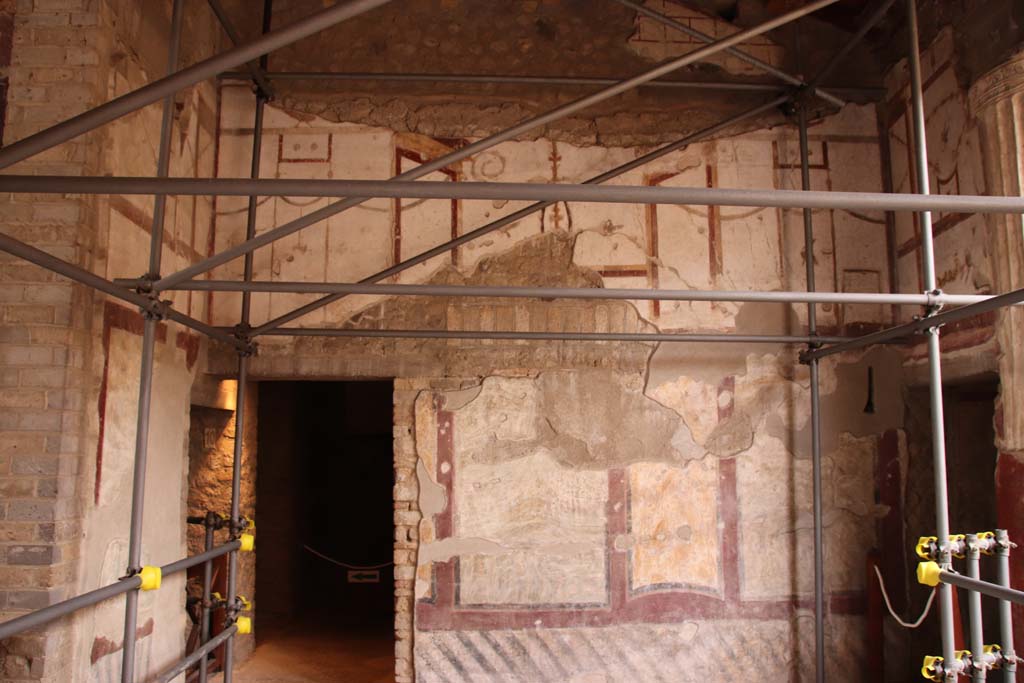 Oplontis Villa of Poppea, October 2020. 
Room 4, west wall with doorway to room 9, on left and entrance to corridor 6 to the west portico, on right. 
Photo courtesy of Klaus Heese.