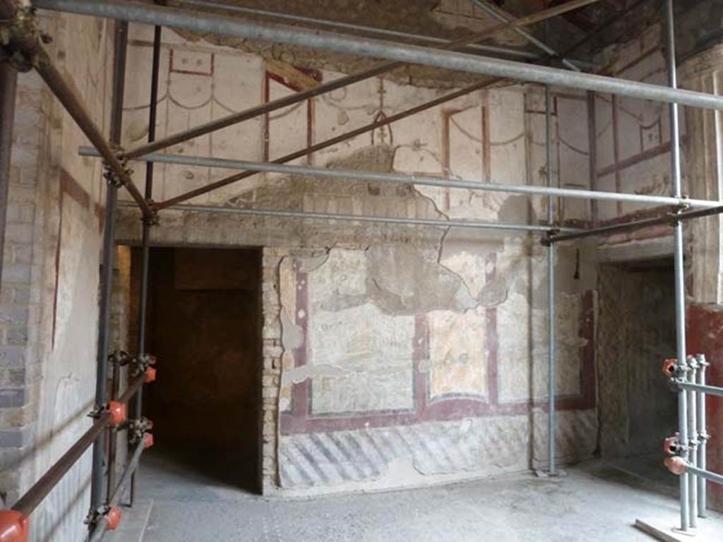 Oplontis Villa of Poppea, September 2015. 
Room 4, west wall with doorway to room 9, on left and entrance to corridor 6 to the west portico, on right.