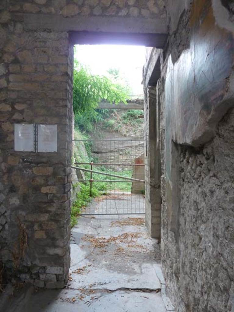 Oplontis, September 2015. Looking west along corridor on south side of atrium, room 5, leading to portico 13, and peristyle19. Doorway to room 11, a cubiculum, can be seen in the centre right.