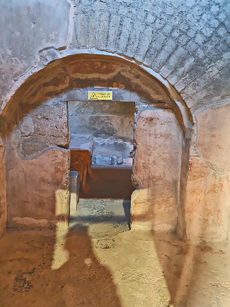 Oplontis Villa of Poppea, October 2023. 
Room 7, looking east through doorway with vaulted surround, at western end of kitchen. Photo courtesy of Giuseppe Ciaramella.