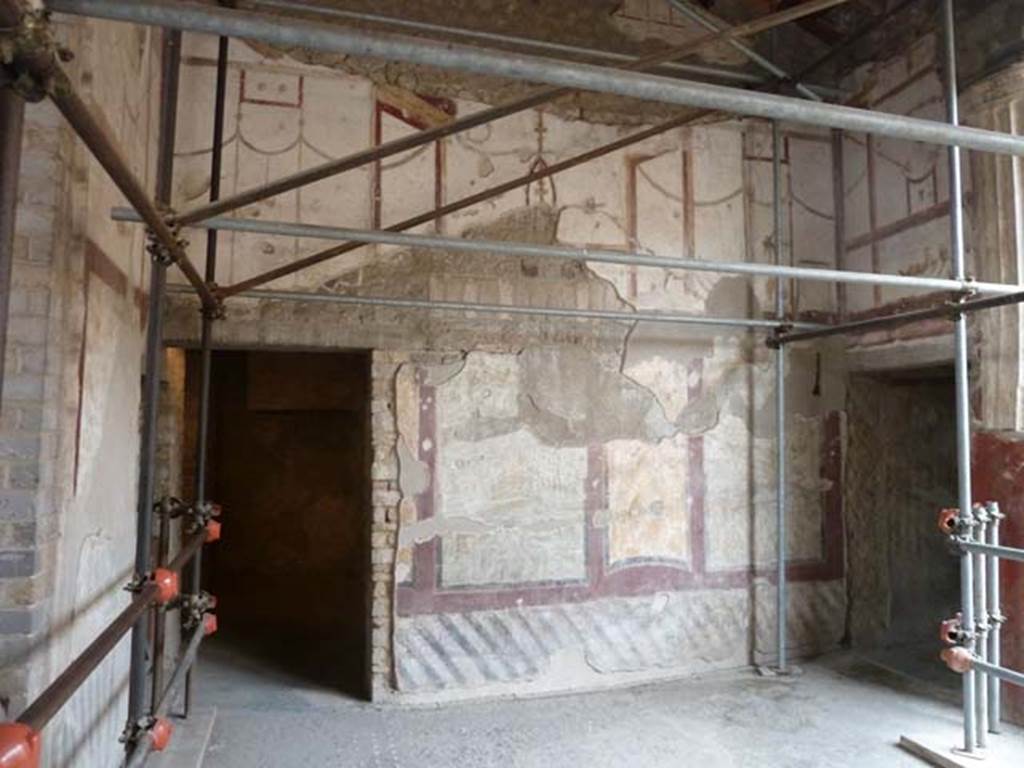 Oplontis, September 2015.  Room 4, west wall with doorway to room 9, on left and entrance to corridor to the west portico, on right.