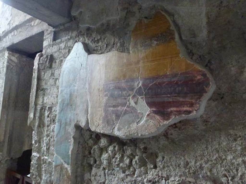 Oplontis, September 2011. Room 11, painted decoration on east side of doorway in south corridor. Photo courtesy of Michael Binns.
