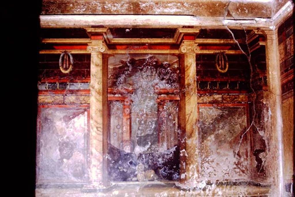 Oplontis, 1973. Room 11, cubiculum on left side of atrium, the wall are painted with architectural elements. Photo by Stanley A. Jashemski. 
Source: The Wilhelmina and Stanley A. Jashemski archive in the University of Maryland Library, Special Collections (See collection page) and made available under the Creative Commons Attribution-Non Commercial License v.4. See Licence and use details. J73f0359