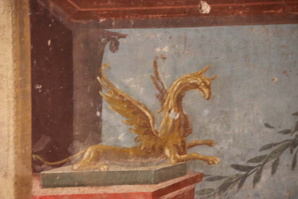 Oplontis Villa of Poppea, September 2021.  
Room 14, painted griffin, detail from left side of central panel of west wall of triclinium. Photo courtesy of Klaus Heese.