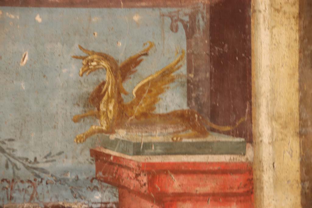 Oplontis Villa of Poppea, September 2021.  
Room 14, painted griffin, detail from right side of central panel of west wall of triclinium. Photo courtesy of Klaus Heese.