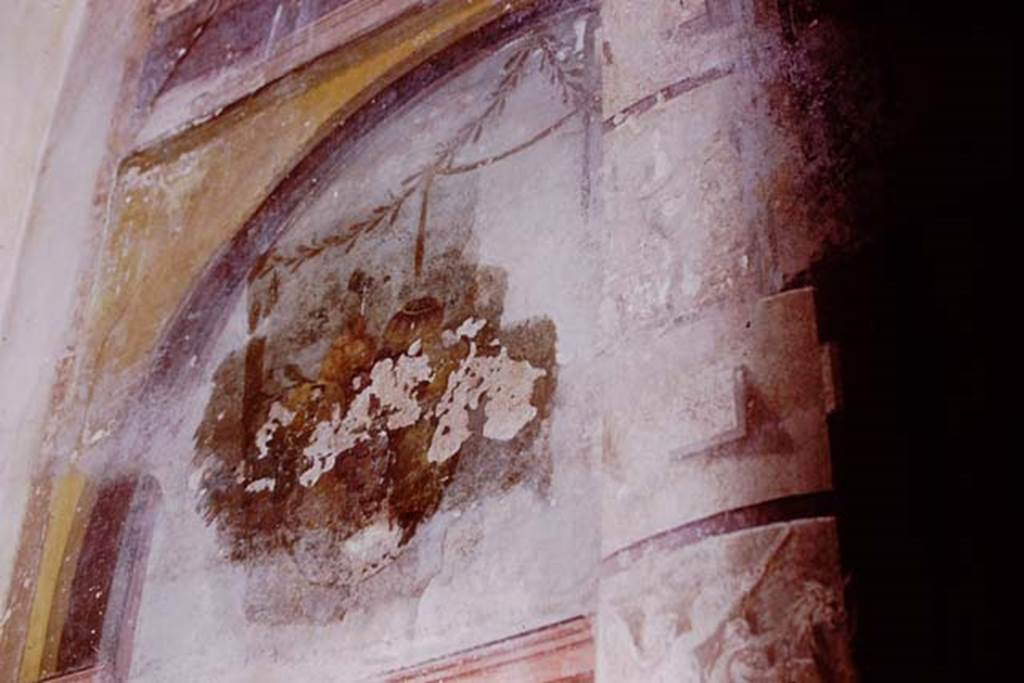Oplontis Villa of Poppea, 1975. Room 14, triclinium, upper side panel of north wall, on left of above photo. 
Photo by Stanley A. Jashemski.   
Source: The Wilhelmina and Stanley A. Jashemski archive in the University of Maryland Library, Special Collections (See collection page) and made available under the Creative Commons Attribution-Non Commercial License v.4. See Licence and use details.
J75f0257