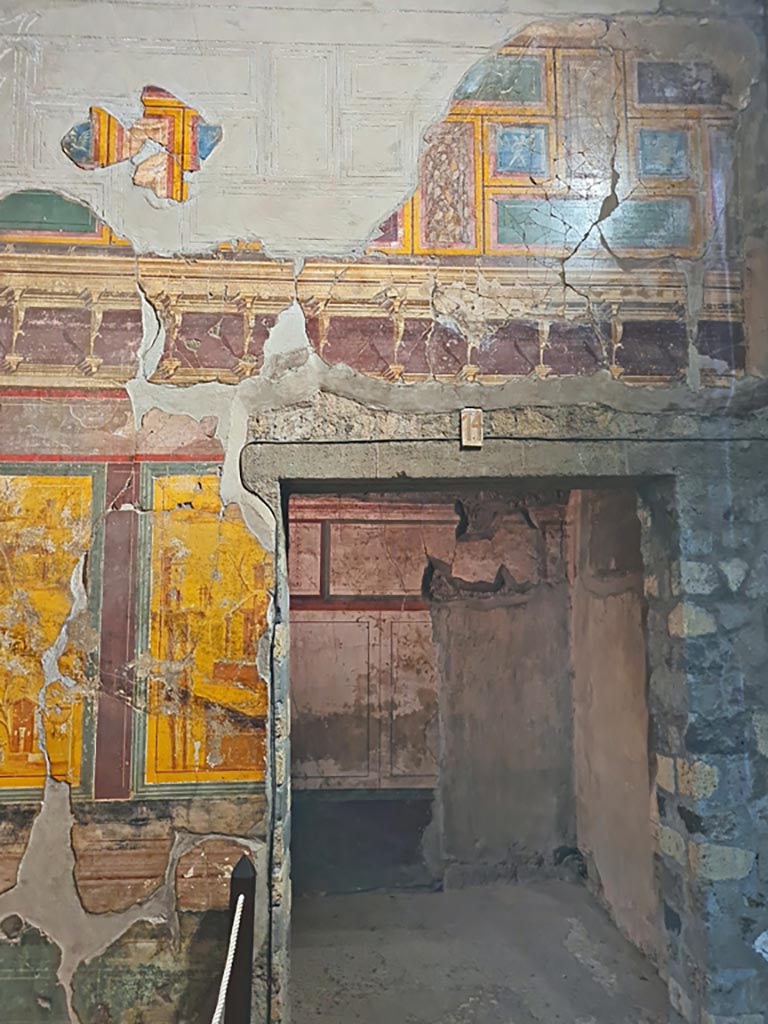 Oplontis Villa of Poppea, October 2023. 
Room 14, east wall with painted decoration above doorway to room 10b.Photo courtesy of Giuseppe Ciaramella.