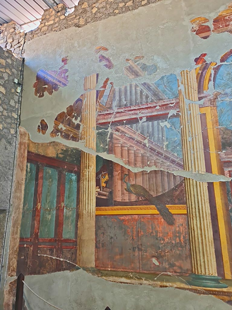 Oplontis Villa of Poppea, October 2023. 
Room 15, detail of painted decoration at side of doorway at north end of east wall.  
Photo courtesy of Giuseppe Ciaramella.