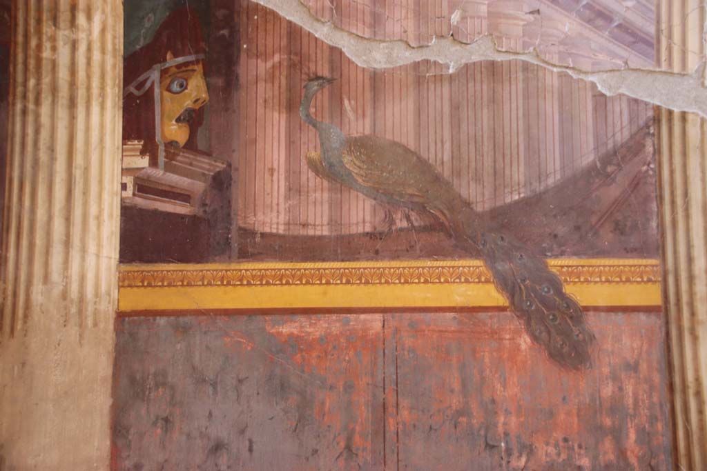 Oplontis Villa of Poppea, September 2021. 
Room 15, detail of tragic mask and peacock, from north end of east wall. Photo courtesy of Klaus Heese.
