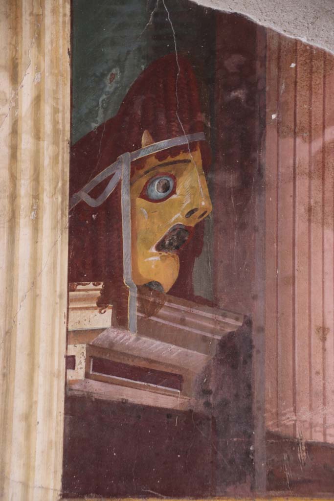 Oplontis Villa of Poppea, September 2021.  
Room 15, detail of tragic mask from north end of east wall. Photo courtesy of Klaus Heese.