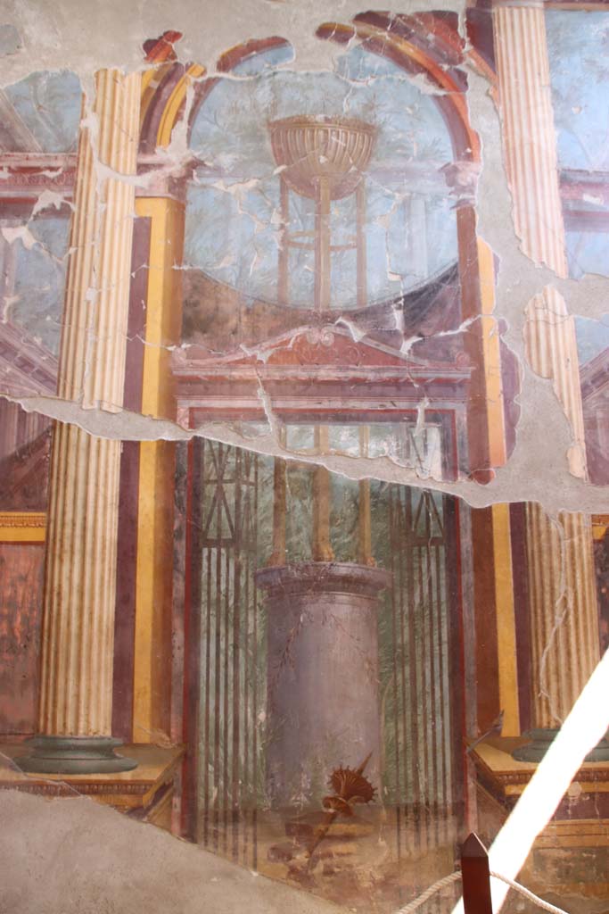 Oplontis Villa of Poppea, September 2021.  
Room 15, central panel from east wall, detail of painting of the Delphic tripod. Photo courtesy of Klaus Heese.