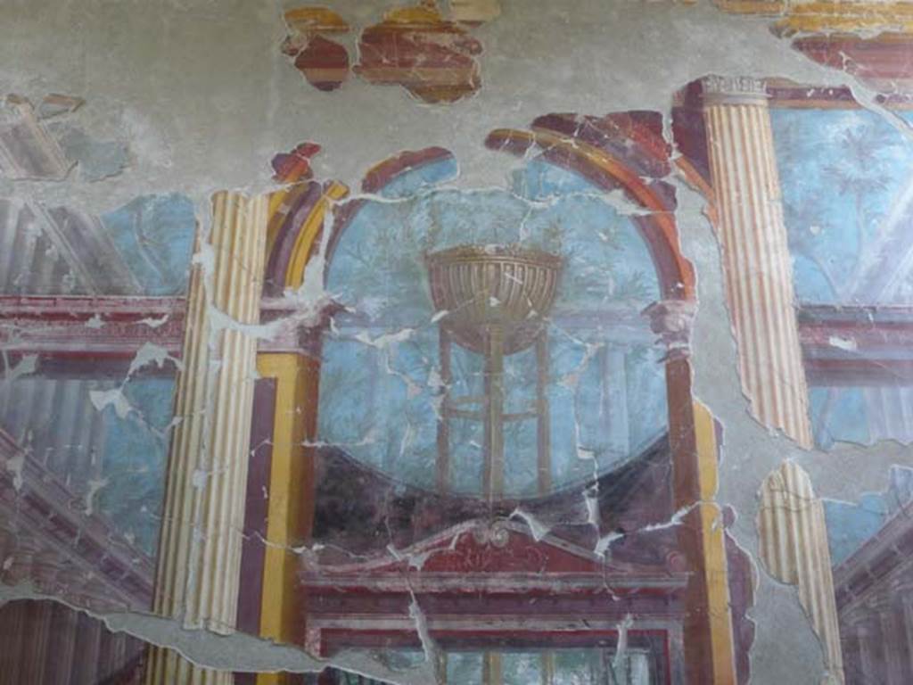 Oplontis, May 2011. Room 15, east wall, detail of painting of the Delphic tripod.  
Photo courtesy of Buzz Ferebee.