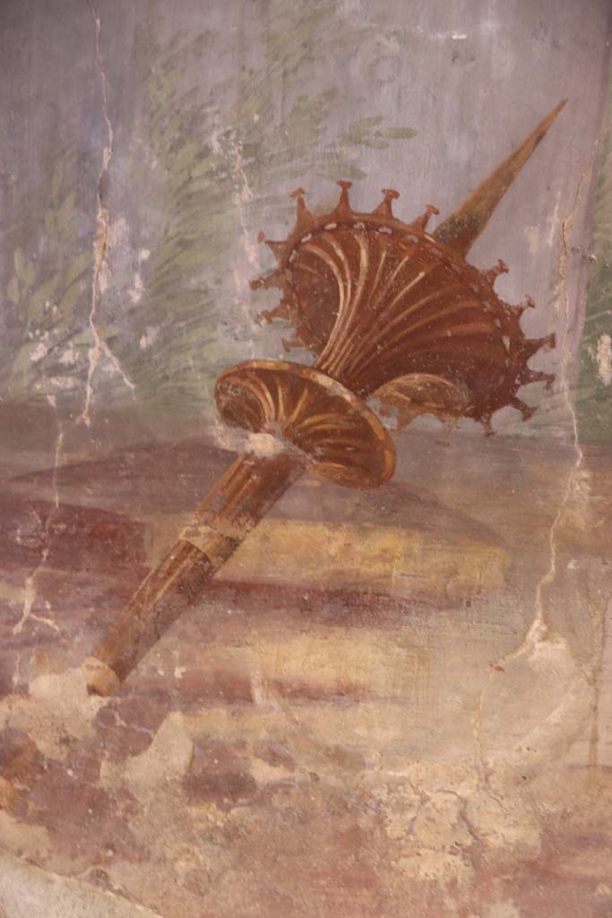 Oplontis Villa of Poppea, September 2021.   
Room 15, detail of Apollonian torch from east wall. Photo courtesy of Klaus Heese.