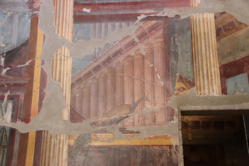 Oplontis Villa of Poppea, October 2022.  
Room 15, painted peacock and tragic mask, from south end of east wall. Photo courtesy of Klaus Heese.