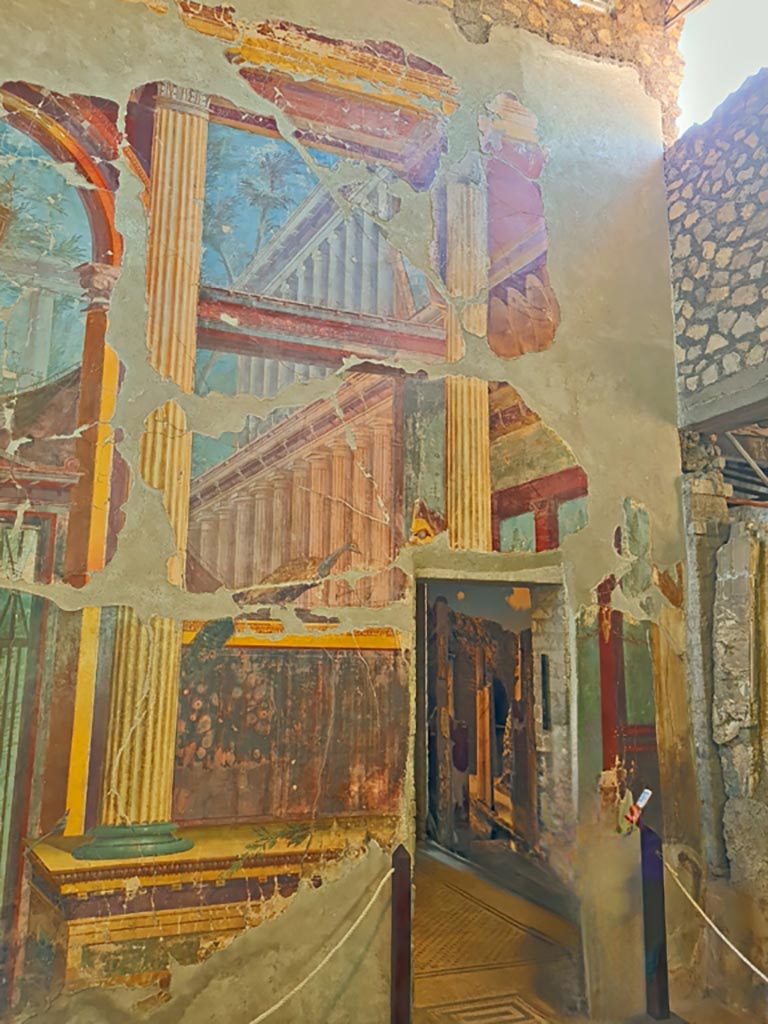 Oplontis Villa of Poppea, October 2023. 
Room 15, detail of painted decoration at south end of east wall and doorway to room 14.  
Photo courtesy of Giuseppe Ciaramella.
