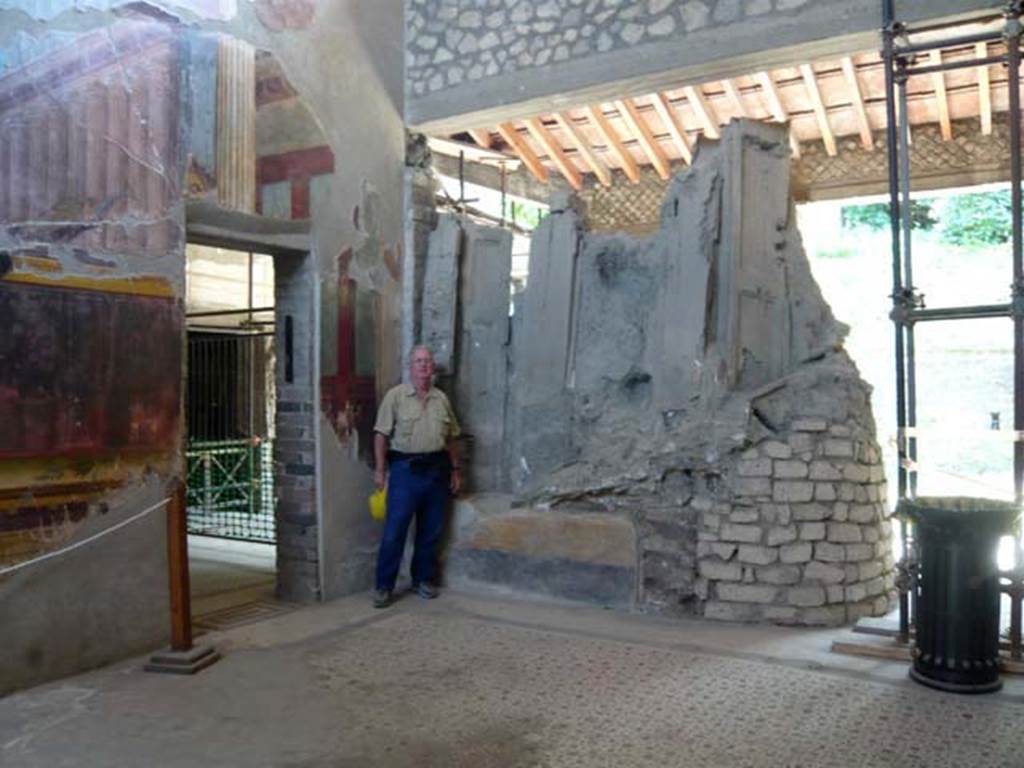 Oplontis, May 2011. Room 15, looking towards south-east corner of the oecus, with Buzz posing to act as a comparison for the size of the window shutters.  Photo courtesy of Buzz Ferebee.