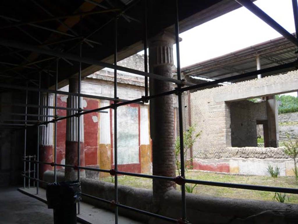 Oplontis, May 2010. Room 20, looking towards the north-west corner, and north wall with window into room 21, the grand oecus, looking through to the north garden. 
Photo taken from area 4. Photo courtesy of Buzz Ferebee.