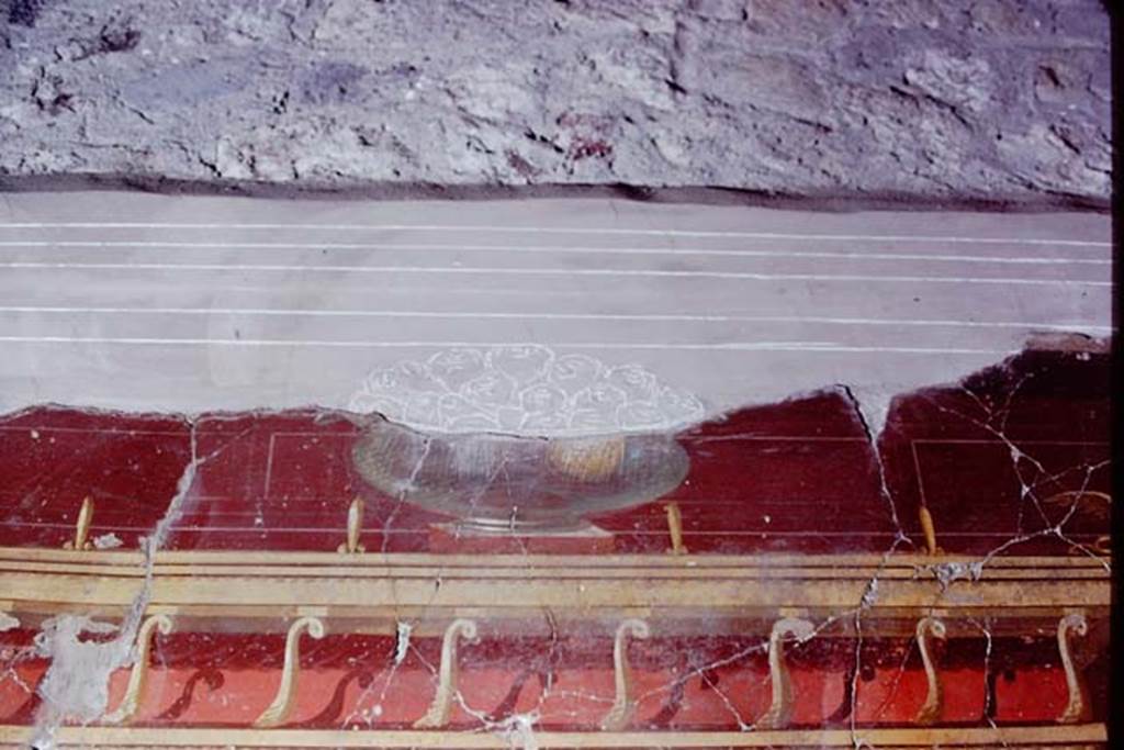 Oplontis, 1972 (or 1973).   Room 23, part of glass fruit-dish filled with pomegranates, before restoration. Photo by Stanley A. Jashemski. 
Source: The Wilhelmina and Stanley A. Jashemski archive in the University of Maryland Library, Special Collections (See collection page) and made available under the Creative Commons Attribution-Non Commercial License v.4. See Licence and use details. J72f0262