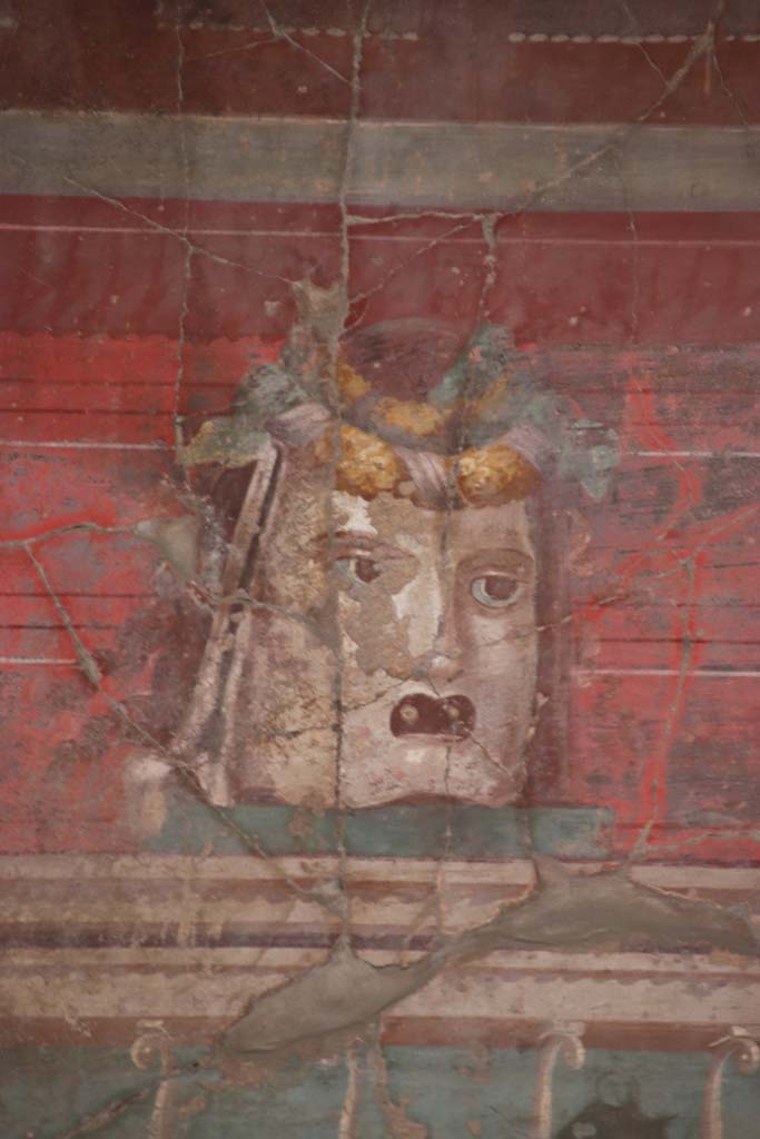 Oplontis Villa of Poppea, September 2021. 
Room 23, detail from mask in centre of west wall. Photo courtesy of Klaus Heese.