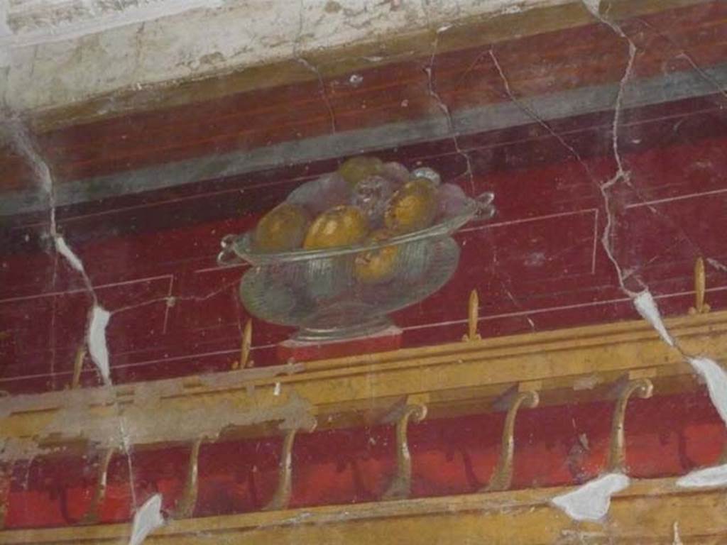 Oplontis, May 2010. Room 23, painted wall with still-life of glass bowl with pomegranates, from north wall.  Photo courtesy of Buzz Ferebee.