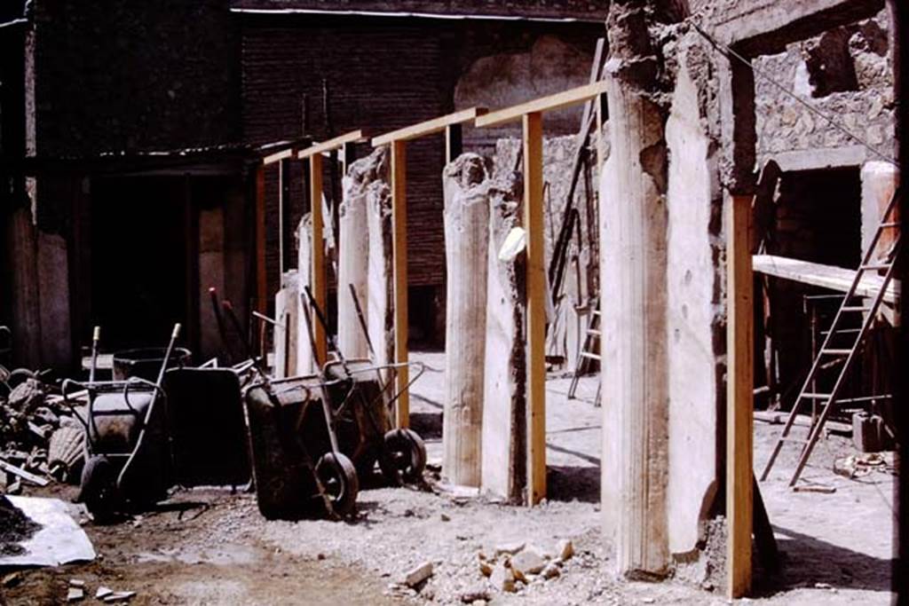 Oplontis, 1973. Looking west along south-west part of peristyle 59 with portico 24, on the right.  Photo by Stanley A. Jashemski.
Source: The Wilhelmina and Stanley A. Jashemski archive in the University of Maryland Library, Special Collections (See collection page) and made available under the Creative Commons Attribution-Non Commercial License v.4. See Licence and use details. J73f0365