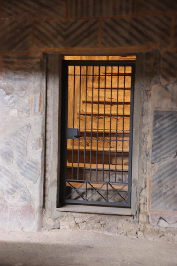 Oplontis Villa of Poppea, May 2024. 
Room 32, doorway in east wall leading to room 42, steps to upper floor. Photo courtesy of Klaus Heese.