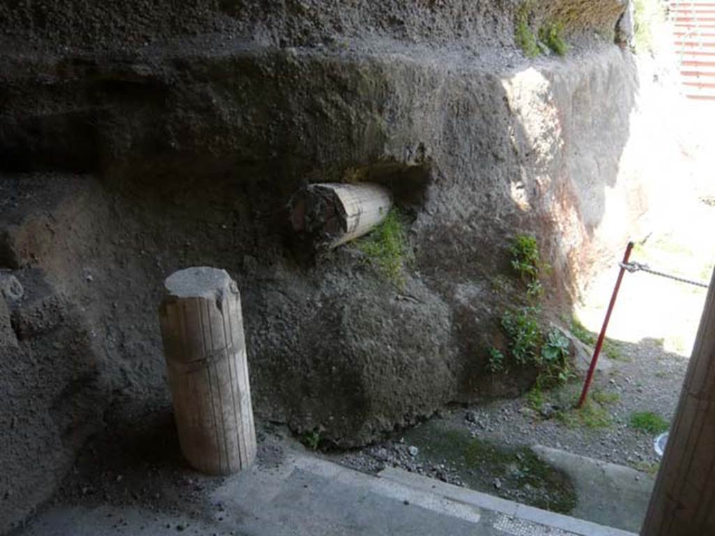 Oplontis, May 2011. West portico 33, looking north-west at column snapped off and embedded in volcanic debris, on extreme west of portico at base of entrance stairs.
Photo courtesy of Buzz Ferebee.