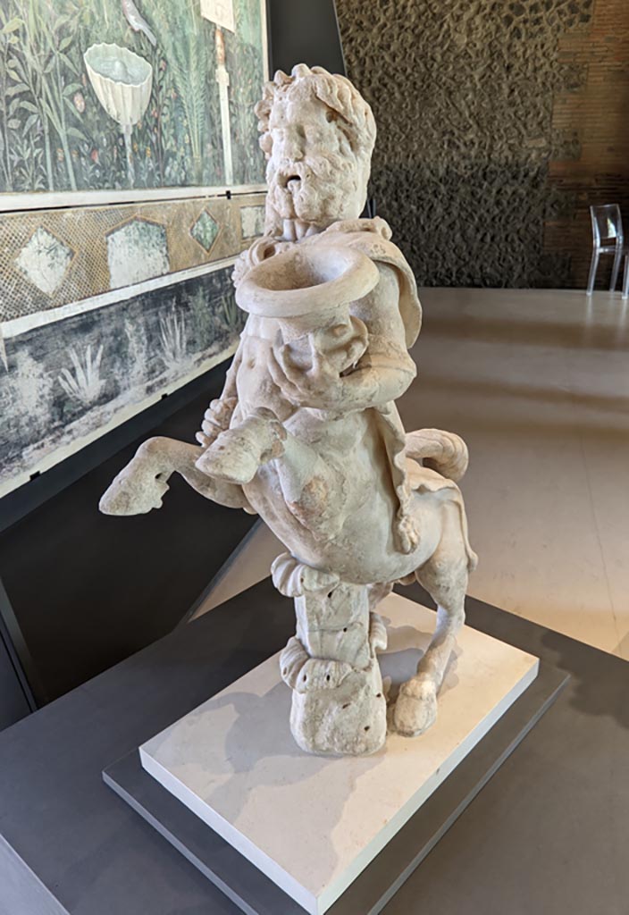 Oplontis Villa of Poppea, April 2022. 
Statuette of Centaur holding a club and a crater. Photo courtesy of Giuseppe Ciaramella.