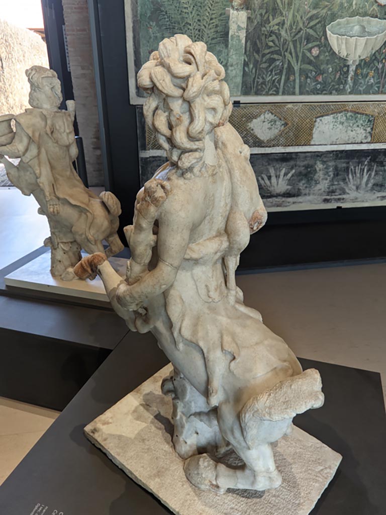 Oplontis Villa of Poppea, April 2022. 
Rear of statuette of a female holding a fawn. Photo courtesy of Giuseppe Ciaramella.