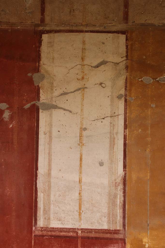 Oplontis Villa of Poppea, October 2020. 
East Portico 34, detail of golden candelabra on white painted panel. Photo courtesy of Klaus Heese.