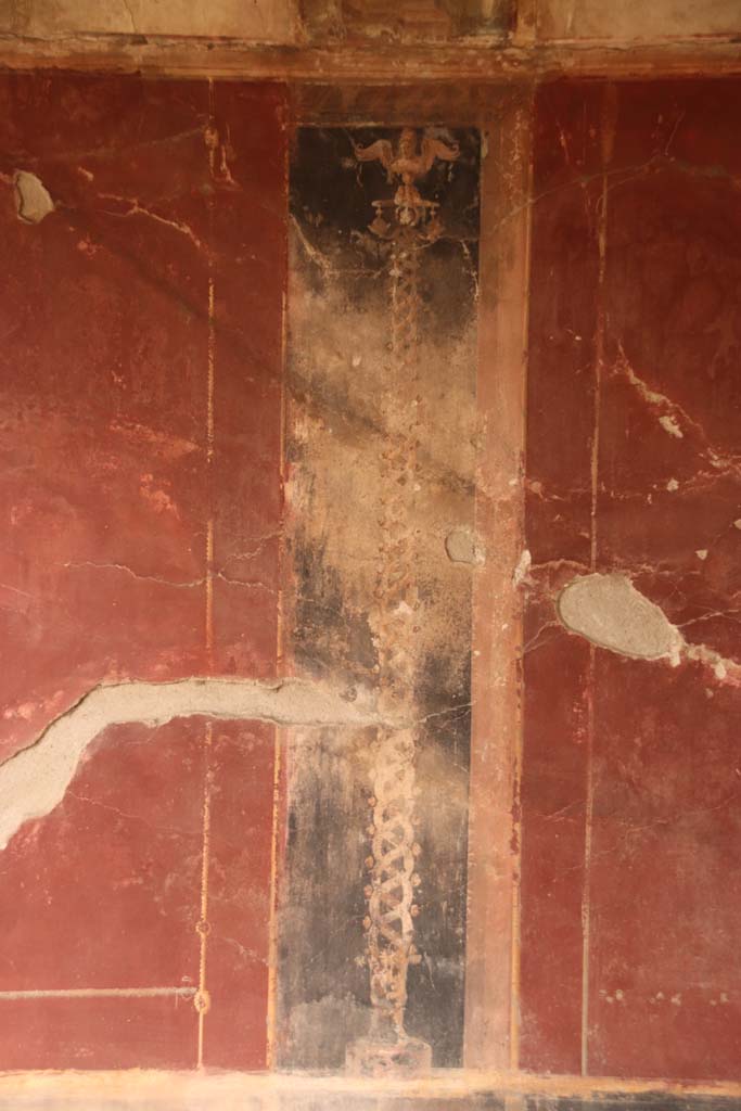 Oplontis Villa of Poppea, October 2020. 
Area 40, painted golden twisted candelabra set in a black panel from north wall in north-east corner. 
Photo courtesy of Klaus Heese.