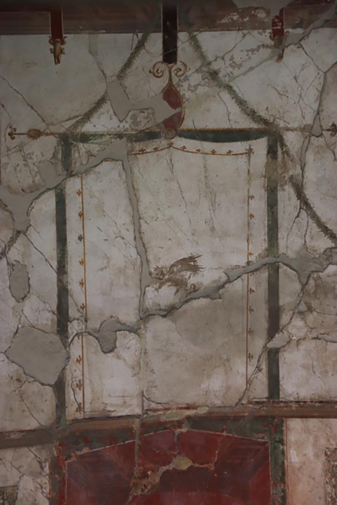 Oplontis Villa of Poppea, May 2024. 
Room 41, detail from upper west wall in centre of alcove, griffin. Photo courtesy of Klaus Heese.