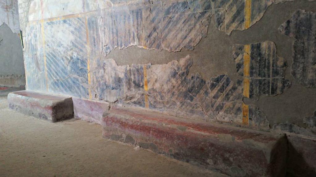 Oplontis Villa of Poppea, April 2016. 
Corridor 46, detail of benches and painted wall decoration on south wall. Looking east. Photo courtesy of Giuseppe Ciaramella.