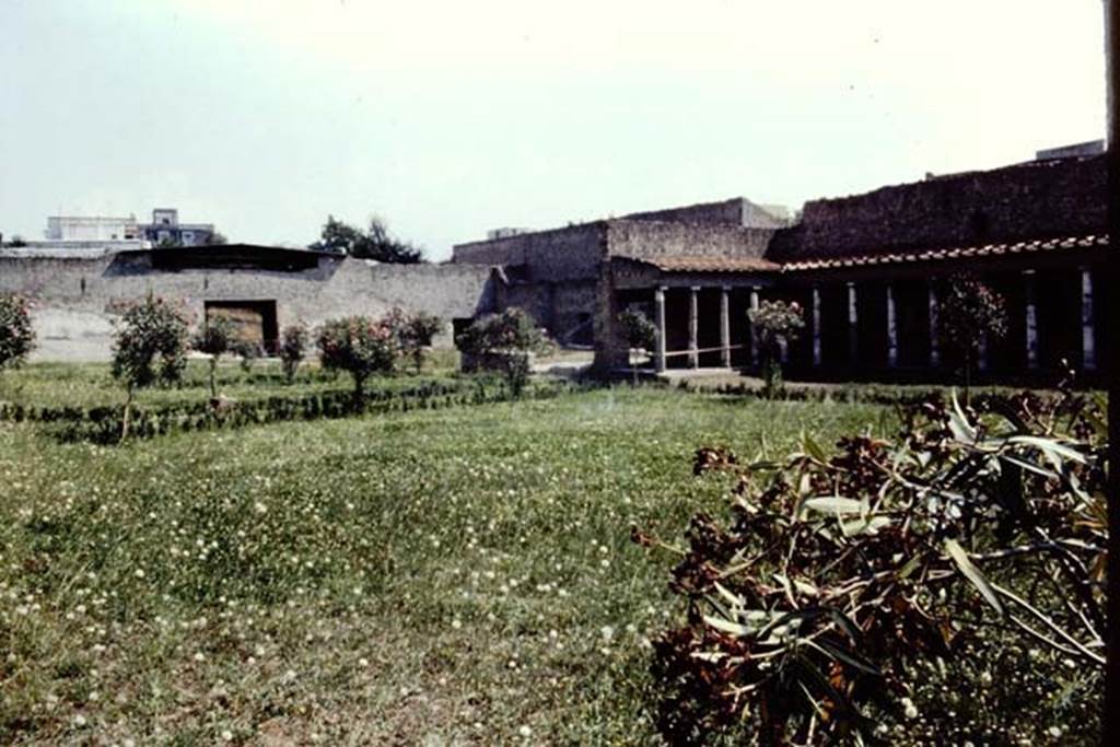 Oplontis Villa of Poppea, c.1983 or 1984. Looking south-east across north garden 56, towards east complex of rooms, with square doorway to exedra 69.
Source: The Wilhelmina and Stanley A. Jashemski archive in the University of Maryland Library, Special Collections (See collection page) and made available under the Creative Commons Attribution-Non Commercial License v.4. See Licence and use details.
Oplo0077