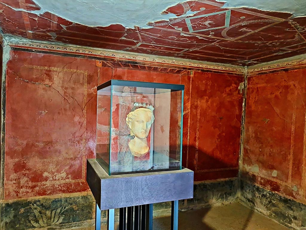 Oplontis Villa of Poppea, October 2023. 
North garden 56, white marble head of the goddess Aphrodite on display here in Room 38. Photo courtesy of Giuseppe Ciaramella.