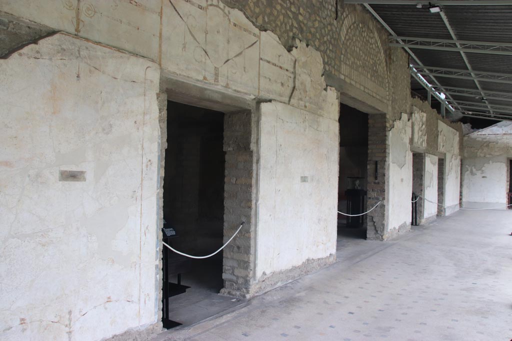 Villa of Poppaea, Oplontis, October 2023. 
Portico 60, painted decoration on west wall, with south side of doorway to room 72, on left. Photo courtesy of Klaus Heese.