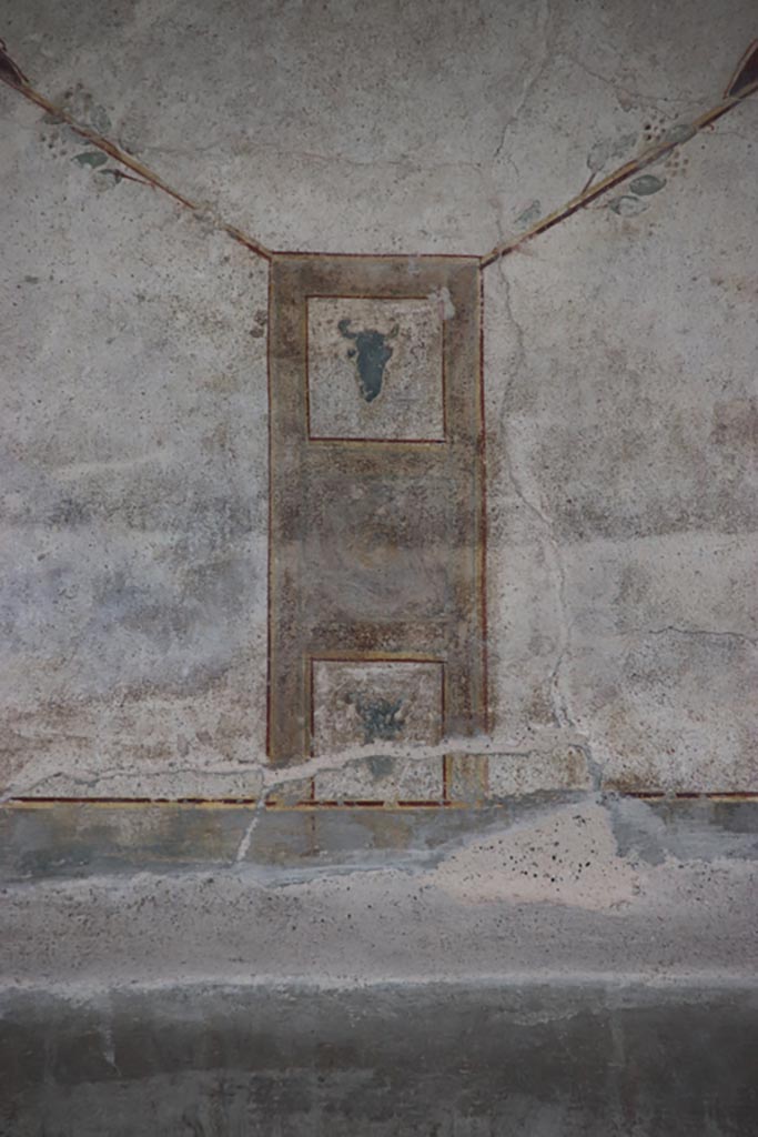 Villa of Poppaea, Oplontis, October 2023. 
Area 60, detail of painted decoration from west portico wall, above the doorway to room 72, in centre. 
Photo courtesy of Klaus Heese.