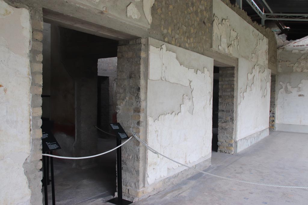 Villa of Poppaea, Oplontis, October 2023. 
Portico 60, looking north along west wall, with doorways to rooms 88, 90 and 94. Photo courtesy of Klaus Heese.