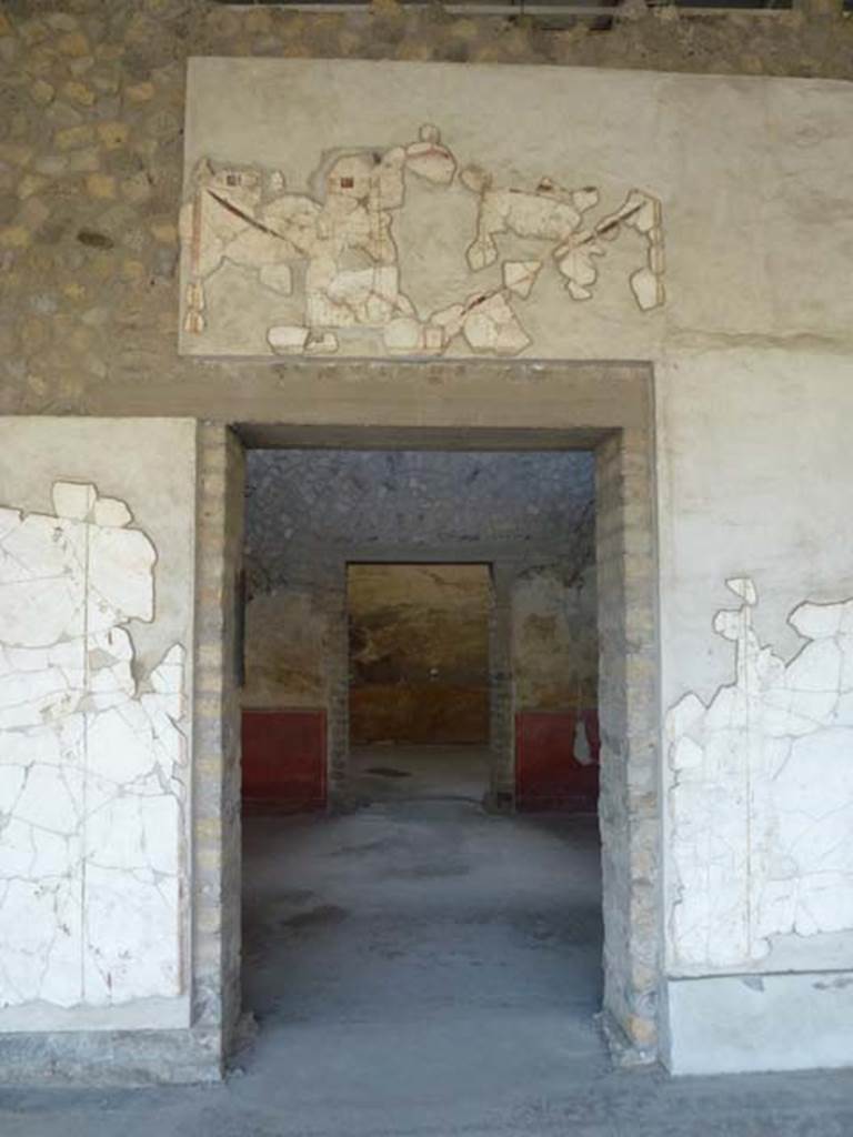 Oplontis, September 2011. Area 60, west portico wall with doorway to room 90.  
Looking west. Photo courtesy of Michael Binns.