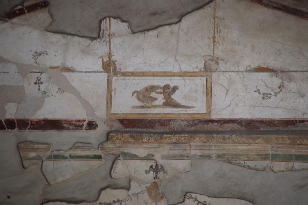 Villa of Poppaea, Oplontis, May 2024.  
Area 60, detail of painted decoration from north wall above doorway to room 97. Photo courtesy of Klaus Heese.