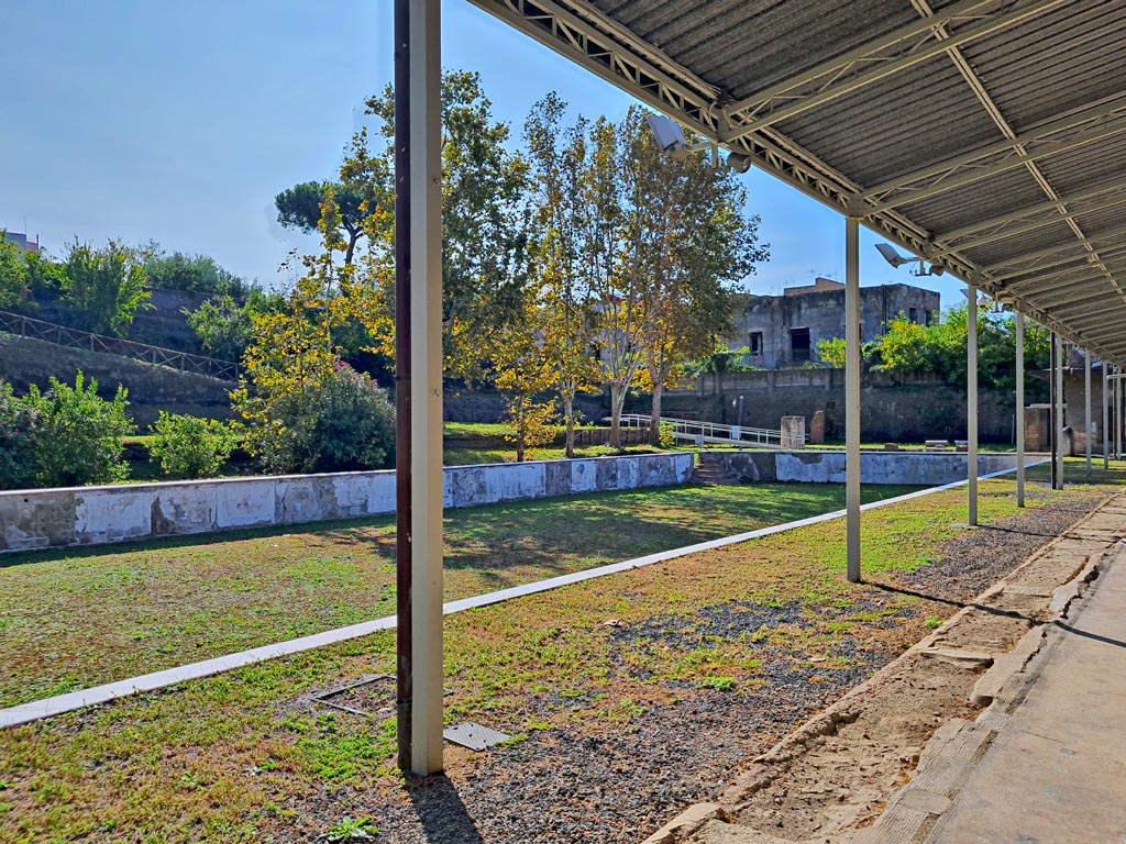 Oplontis Villa of Poppea, October 2023. Area 60, looking south from west portico across pool. Photo courtesy of Giuseppe Ciaramella.