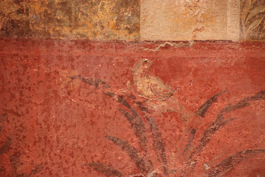 Oplontis Villa of Poppea, October 2020. Room 70, detail of bird on red zoccolo/dado beneath fountain on north wall in north-west corner. 
Photo courtesy of Klaus Heese.